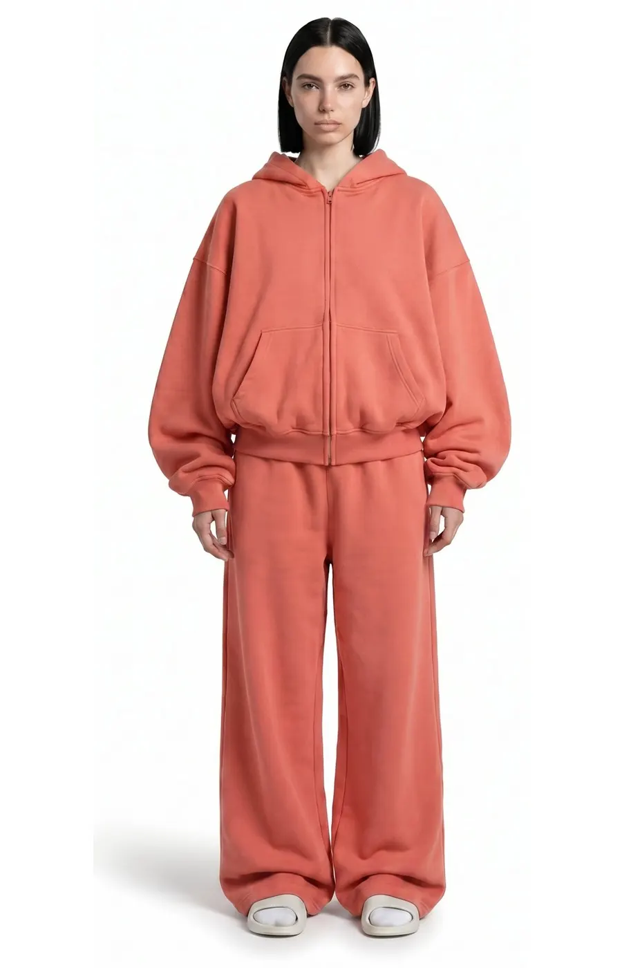 Model wearing Ghost 44 Factory coral zip hoodie and joggers, front view